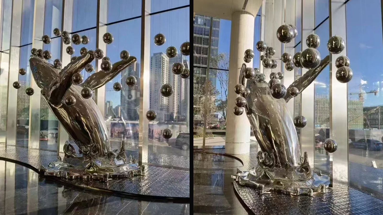 Two views of a mirror stainless steel whale sculpture with suspended spheres in a glazed commercial lobby
